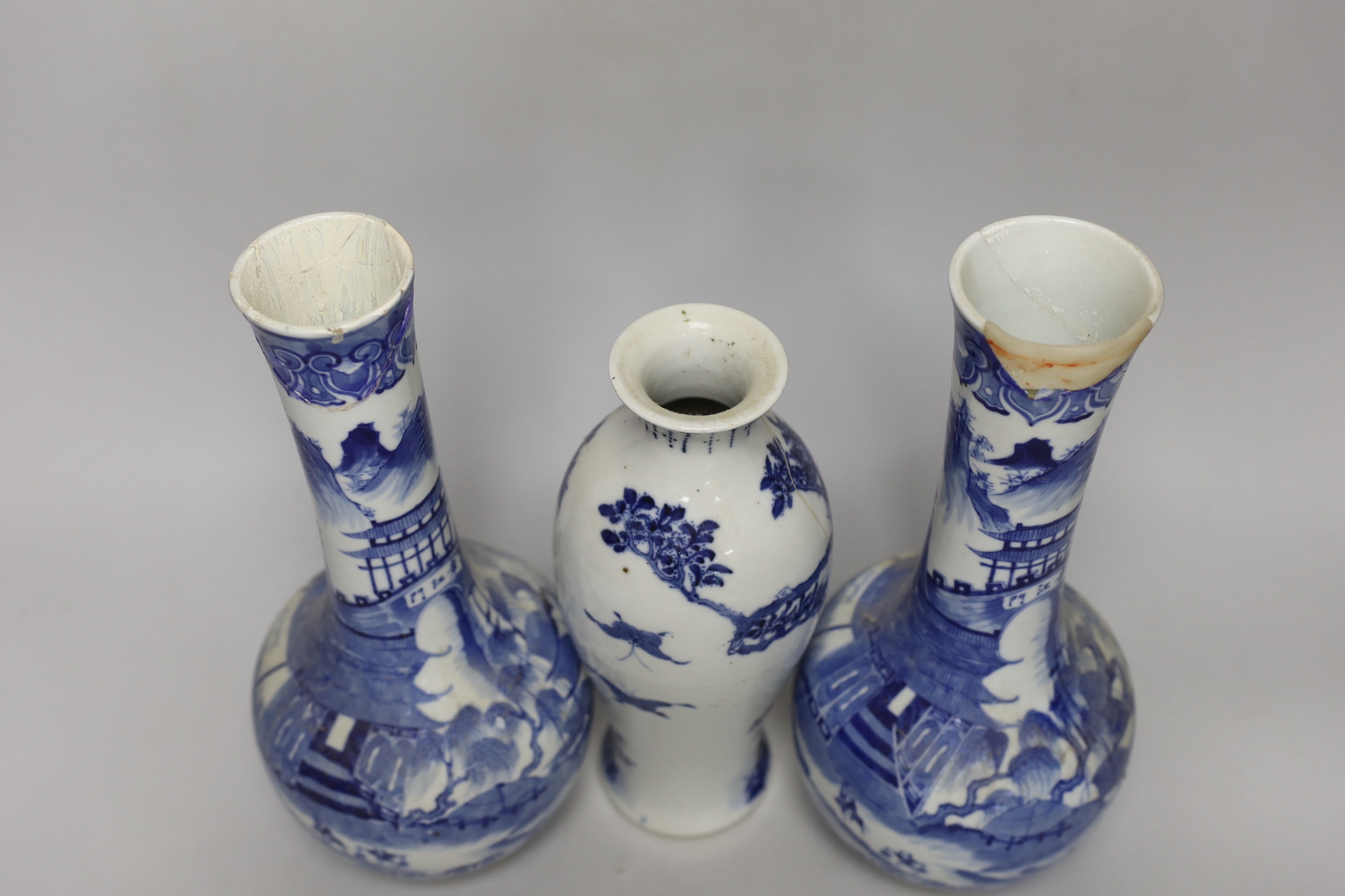 A pair of Chinese blue and white bottle vases and another vase, pair of vases 30cm high (a.f.)